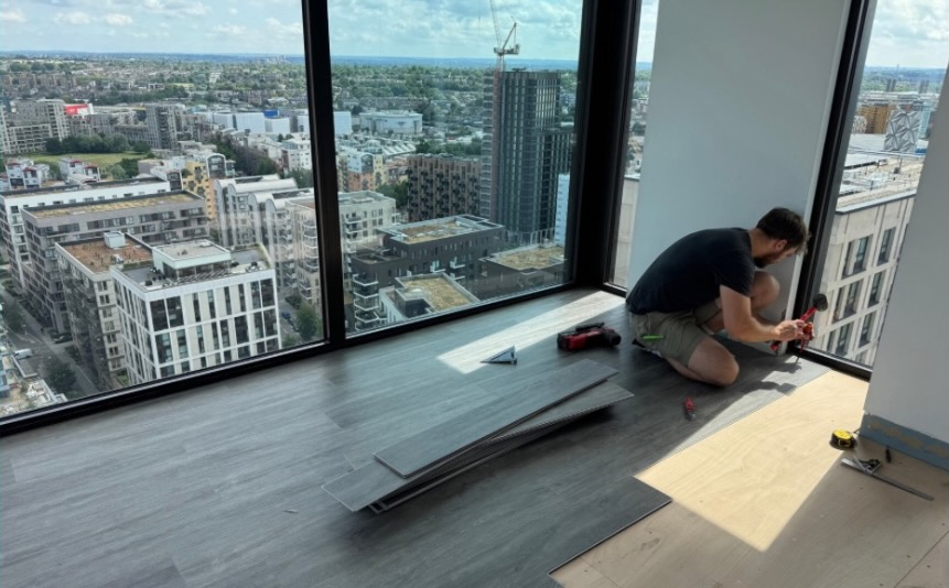 Flooring being fitted in an apartment as part of SWS property improvement work