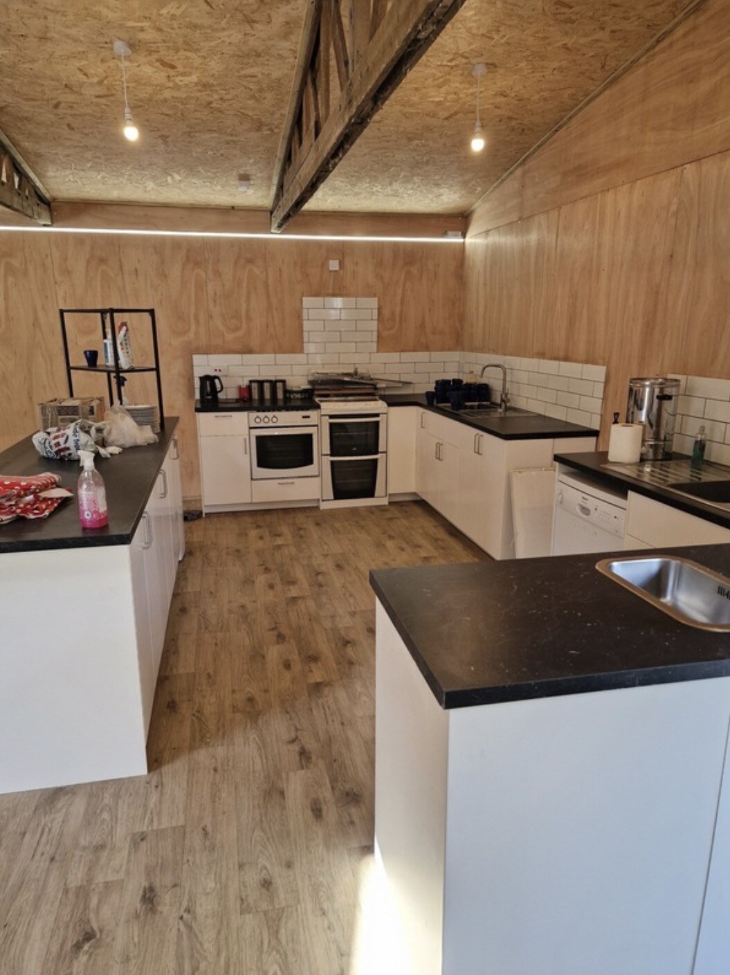 Completed fitted kitchen in timber garden building